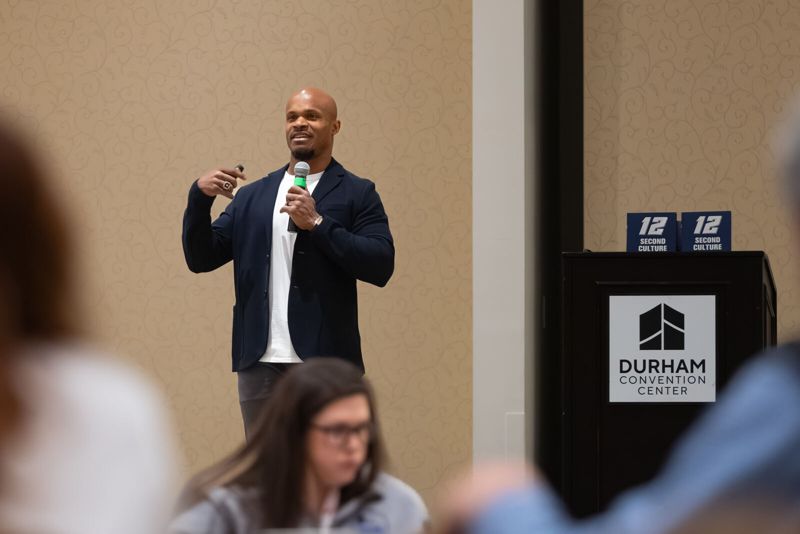 Speaker presenting at a Carolinas Roofing & Sheet Metal Contractors Association event